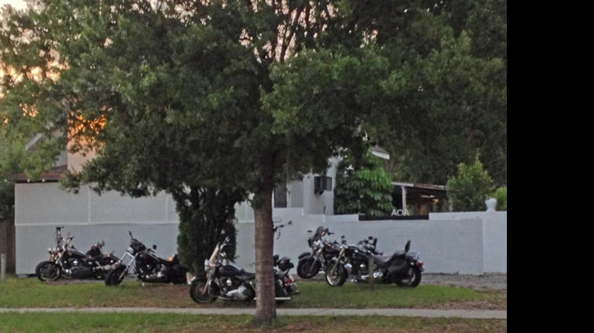 
Members of the Outlaws motorcycle club congregate outside their clubhouse in St. Petersburg. 
