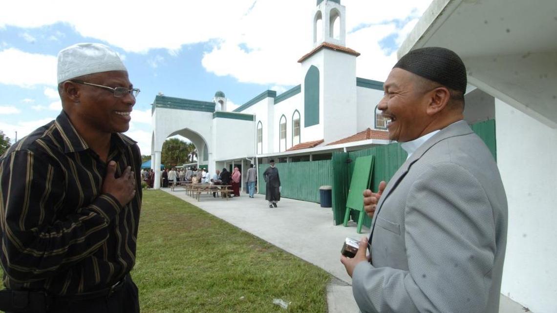 Two men talk at the Masjid Mosque in Miami Gardens after a service in 2008.