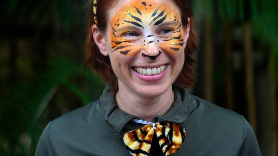 In this March 7, 2015 photo, Stacey Konwiser smiles during the dedication of the new tiger habitat at the Palm Beach Zoo in West Palm Beach. Stacey Konwiser, 38, was attacked and killed by a 13-year-old male tiger in an enclosure known as the night house that is not visible to the public, Palm Beach Zoo spokeswoman Naki Carter said. It's where the tigers sleep and are fed.