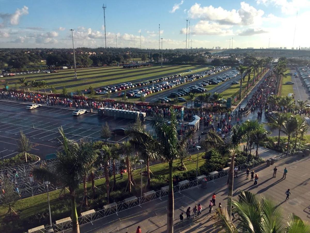 Thousands are lined up early Thursday, Nov. 9, 2017, at Hard Rock Stadium in Miami Gardens during the last day of a three-day registration event to apply for emergency food assistance.