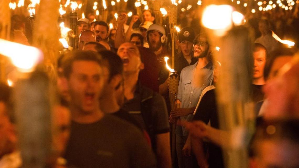 Neo-Nazis, alt-Right, and white supremacists march the night before the "Unite the Right" rally, on Friday, Aug. 11, 2017 through the University of Virginia in Charlottesville, Va.
