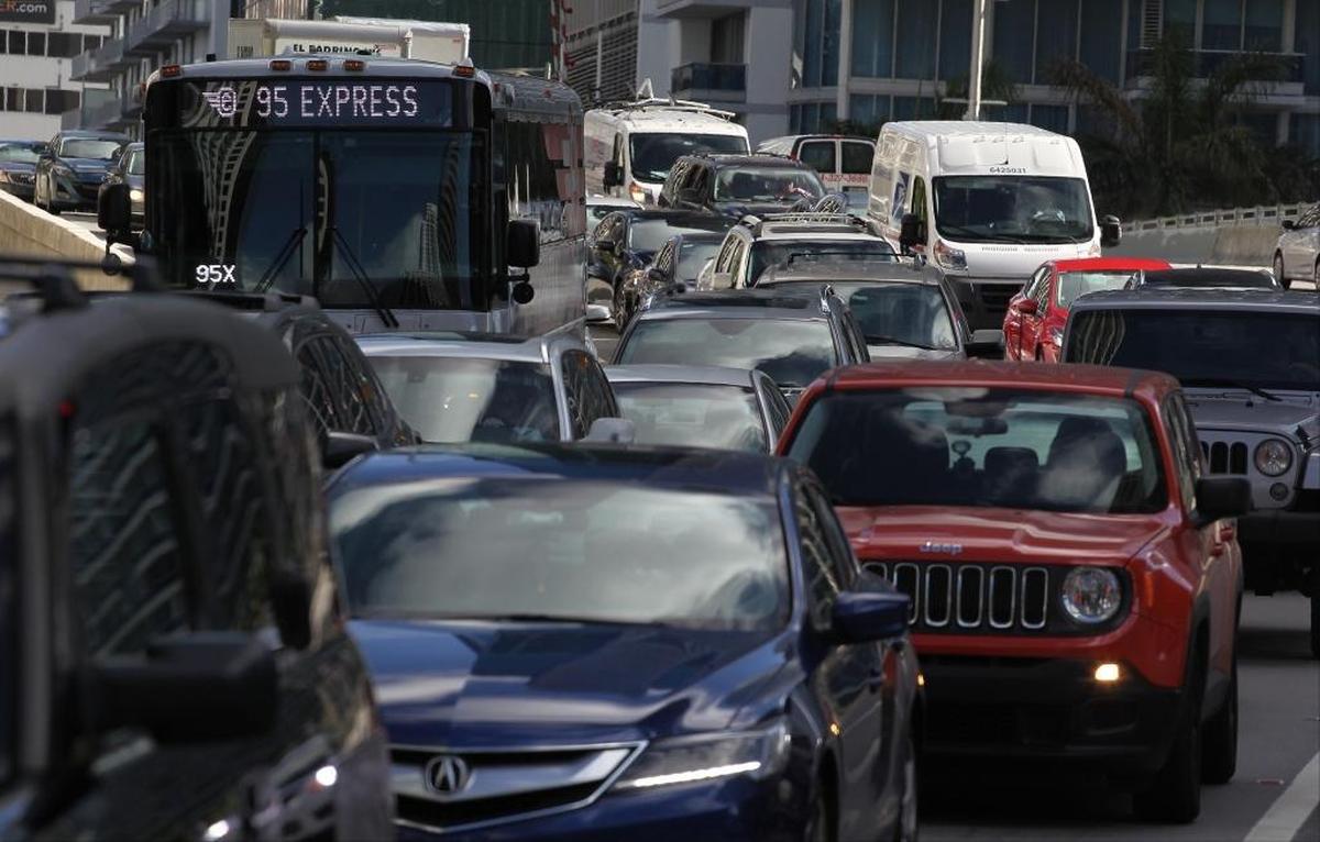 The traffic can stretch for blocks when the Brickell Avenue Bridge goes up and motorist and pedestrian traffic comes to a stand still during rush hour in downtown Miami.
