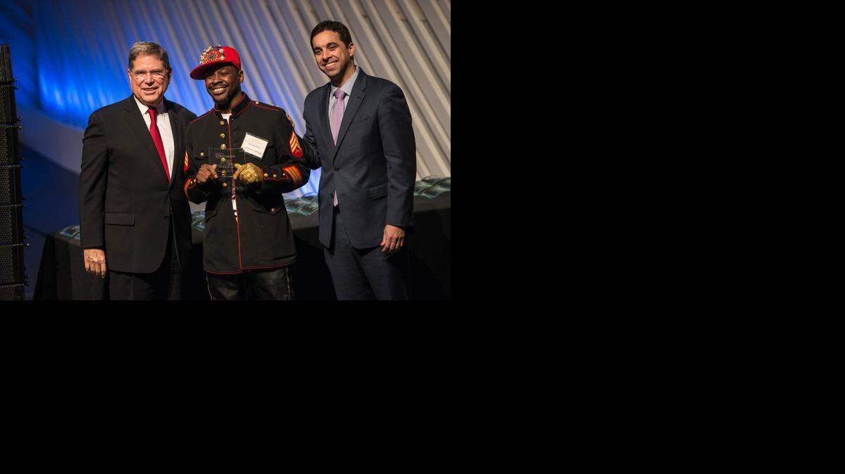 
Zedric Bembry receives $20,000 for a Young Students Trained in Urban Dance project led by the Live in Color Dance Collective from Alberto Ibarguen, president and CEO, and Matt Haggman, program director, during the 2014 Knight Arts Challenge.
