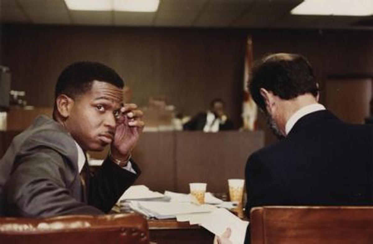Luther Campbell, leader of the Band 2 Live Crew, in court with lawyer Bruce Rogan.