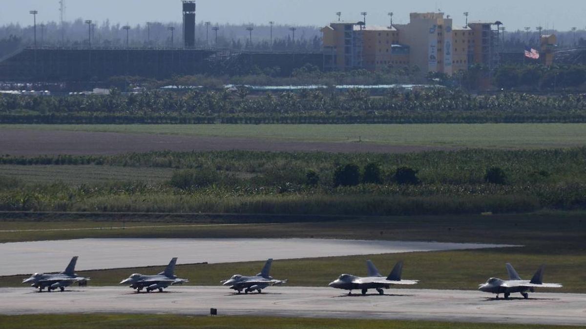 Pilots in both F-16 and F-22 aircraft wait for clearance from the tower to take-off March 2, 2015 during an exercise at Homestead Air Reserve Base, Fla. The 482nd Fighter Wing, Homestead Air Reserve Base, held a large force exercise, CHUMEX, bringing together multiple units and aircraft for training focused on teamwork and real-world combat scenarios.
