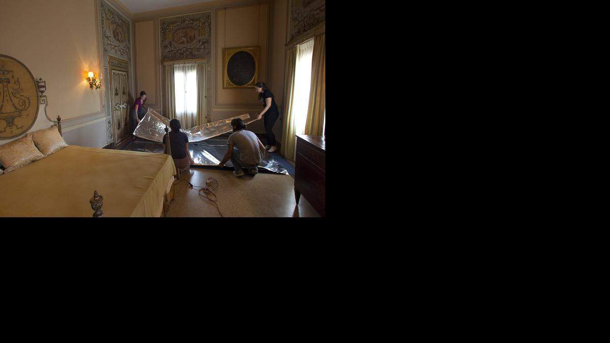 
Conservators build a tent to house the bed and other pieces of furniture for treatment at the Vizcaya.


