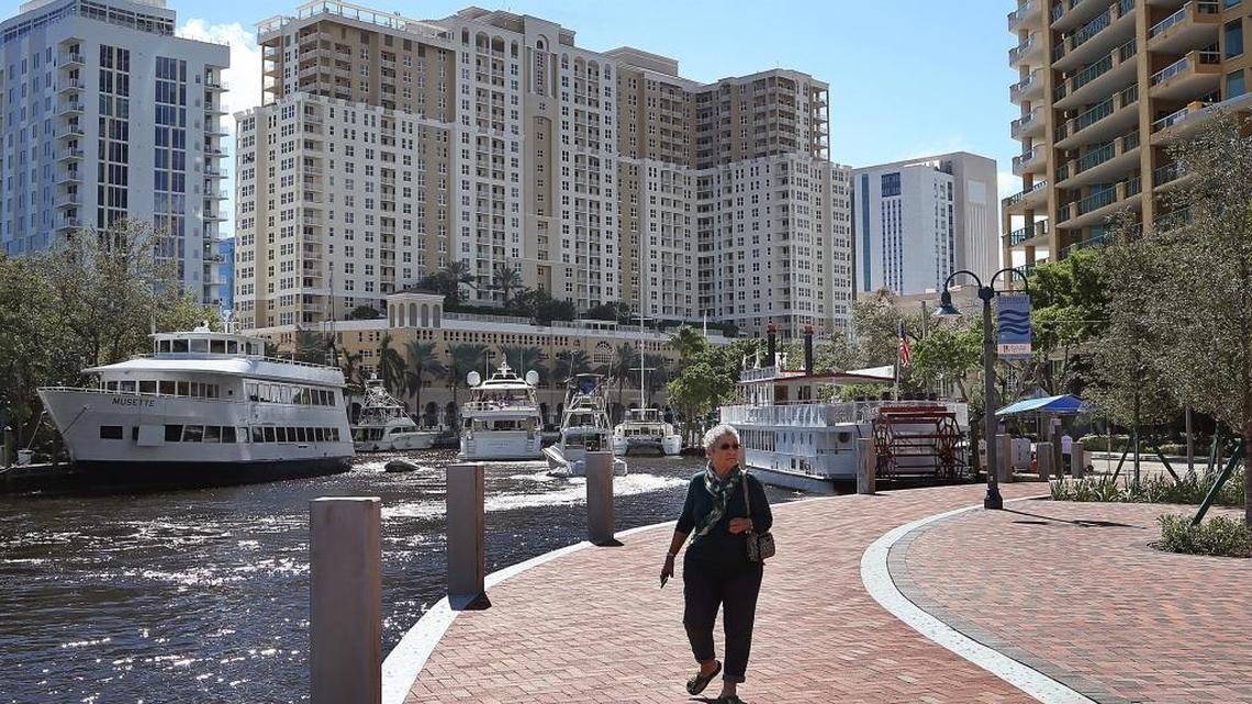 A pedestrian strolls along Downtown Fort Lauderdale’s Riverwalk. Home purchases by investors in Miami and Fort Lauderdale jumped a whopping 90% in the second quarter of 2021, compared with the same period the year before. 