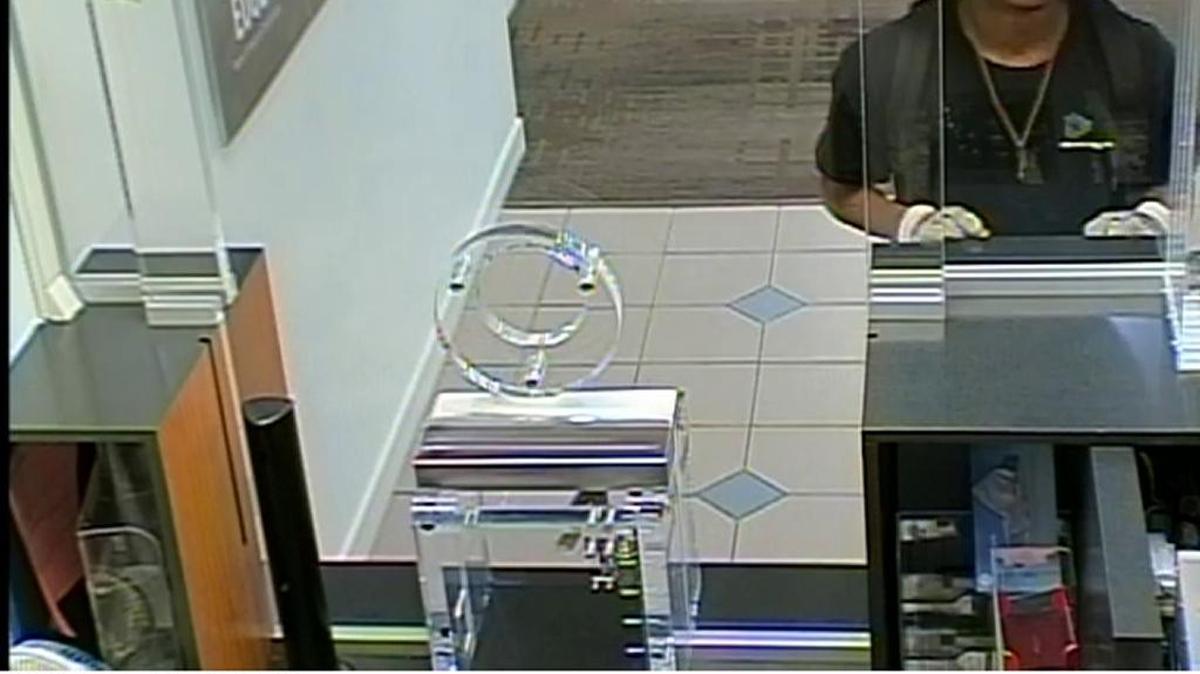 Monday’s Bank of America robber at the teller window.