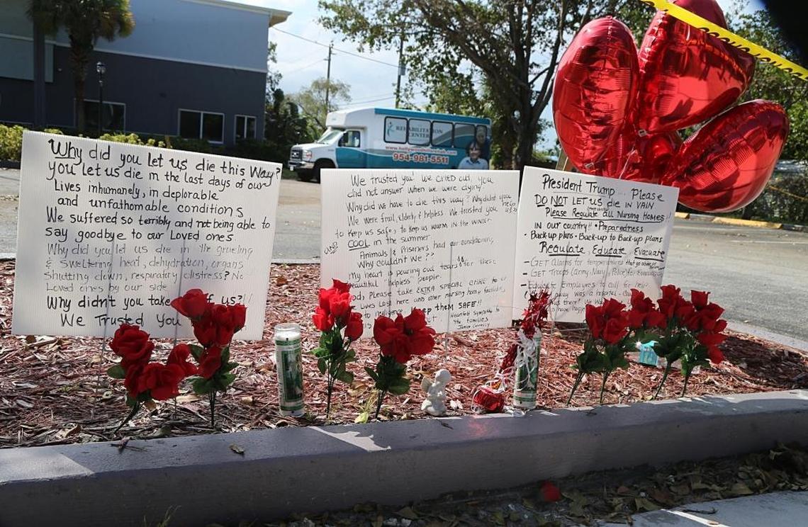Messages, flowers and candles line a spot near the sidewalk of the Rehabilitation Center of Hollywood Hills nursing home a day after eight people died.