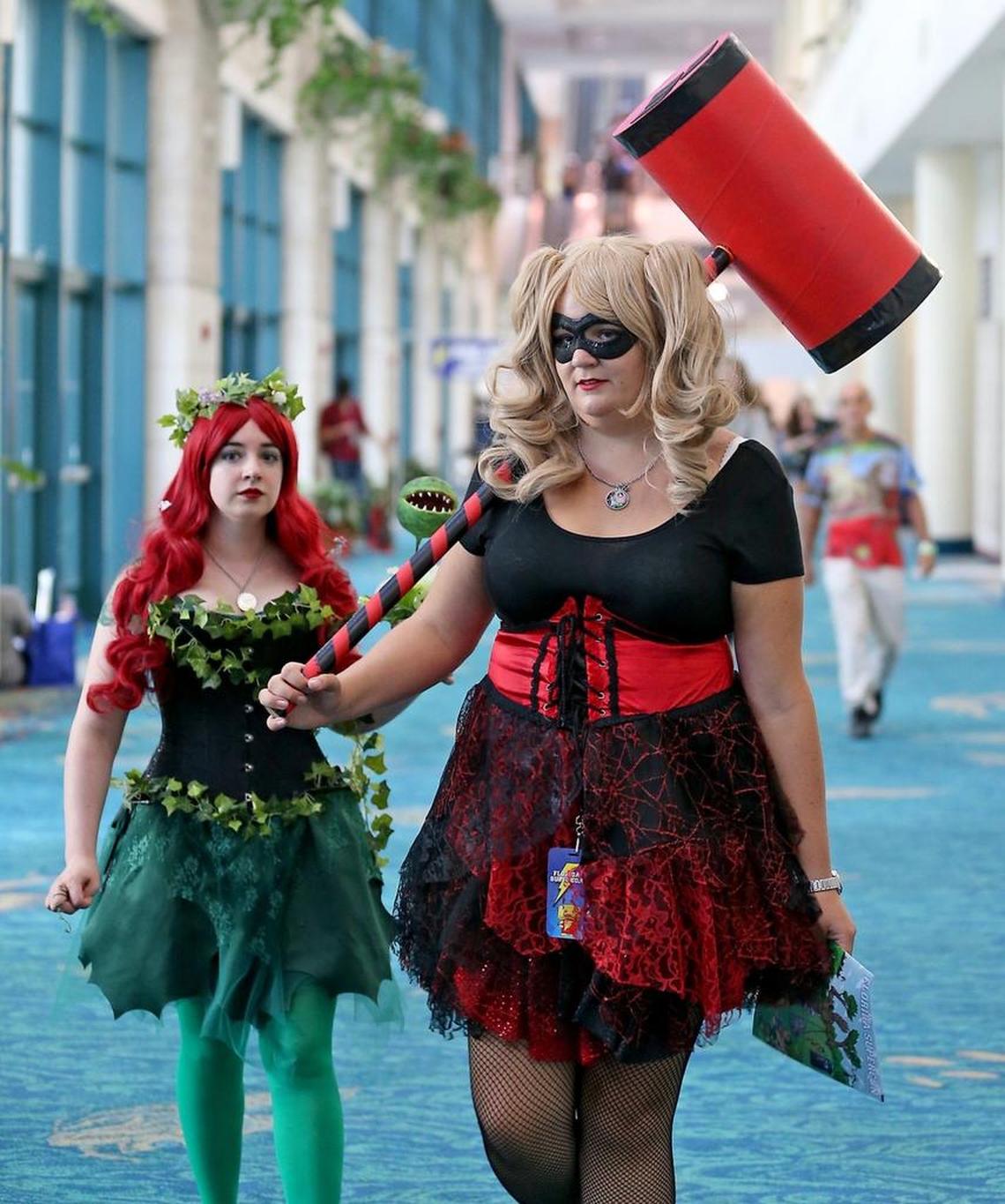 Sarah George, 26, "Poison Ivy" and Leah Groner, 26, "Harley Quinn" enjoy Florida Supercon as it opens at the Broward County Convention Center on Thursday, July 27, 2017.