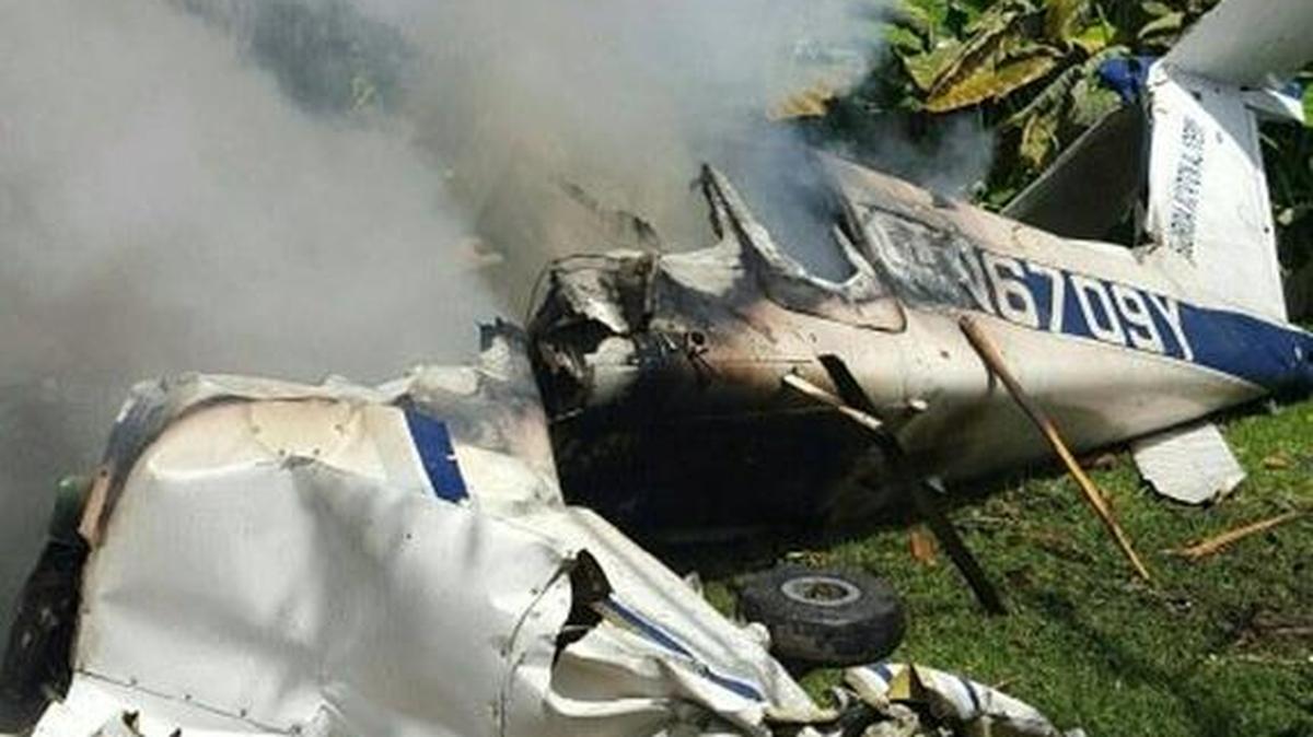 The wreckage of a small plane smolders in Pompano Beach.