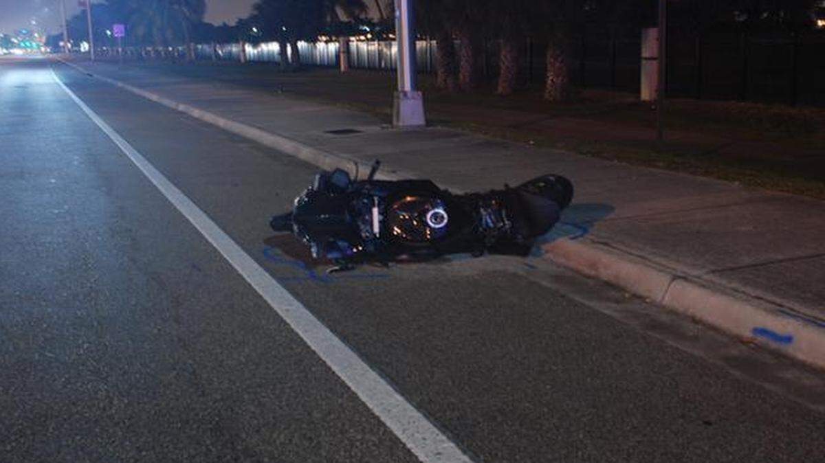 
A photo from the scene of a hit-and-run Wednesday, Dec. 24, 2014 in Pompano Beach shows victim Robert Games’ motorcycle.
