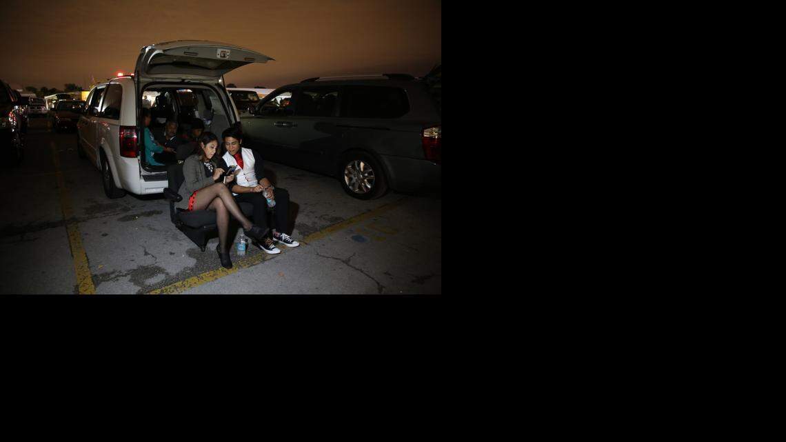 
Gabrielle Florez, 19, and brother, Gregory, 17, and their family from Winter Haven, get ready Thursday for the 7 p.m. showing of ‘The Interview’ at The Swap Shop near Fort Lauderdale.
