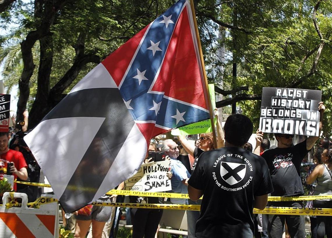 Christopher Rey Monzon, 22, of Hialeah, was arrested Wednesday after charging at protesters outside Hollywood City Hall with his Confederate flag.