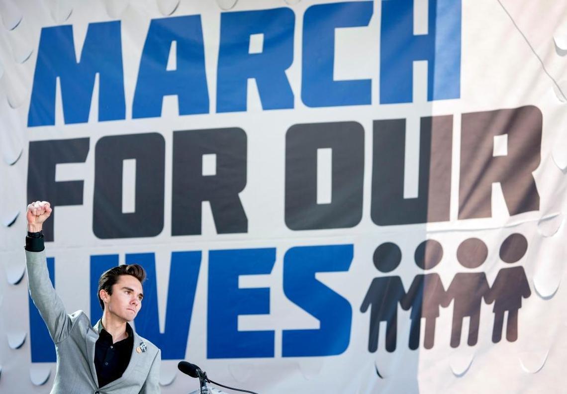 David Hogg, a survivor of the mass shooting at Marjory Stoneman Douglas High School in Parkland, raises his fist after speaking during the March For Our Lives rally in support of gun control in Washington, Saturday, March 24, 2018.