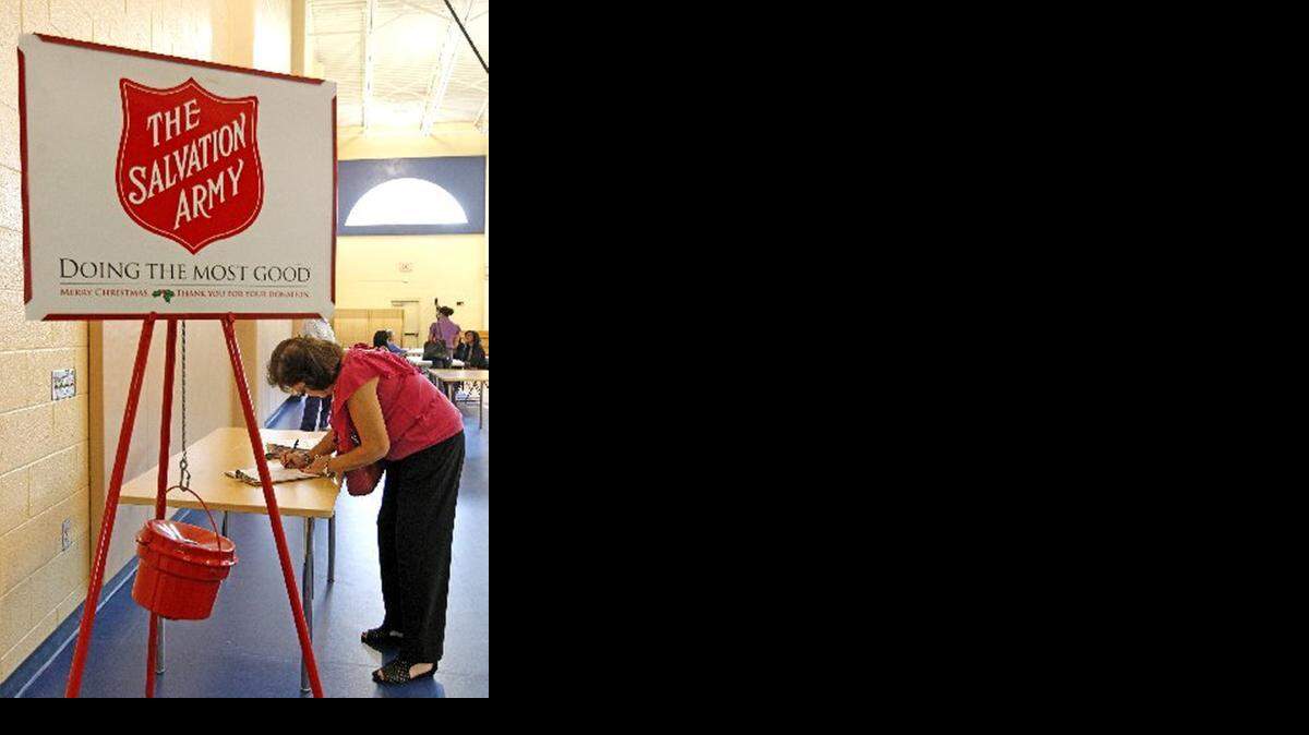 
Miami-Dade and Broward branches of The Salvation Army are hiring Bell Ringers for its annual Red Kettle campaign. Pictured, a woman applies for a position at a job fair in Broward in 2012. Broward will hold two job fairs this year to hire for 50 positions. 
