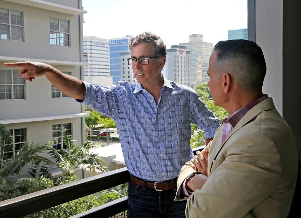 Developers Alan Hooper, left, and Tim Petrillo discuss their loft-style residential developments in Flagler Village, a Fort Lauderdale hotspot that’s helping drive the resurgence of the city’s long overlooked downtown. Hooper and Petrillo have also opened a string of restaurants and bars in the heart of downtown.
