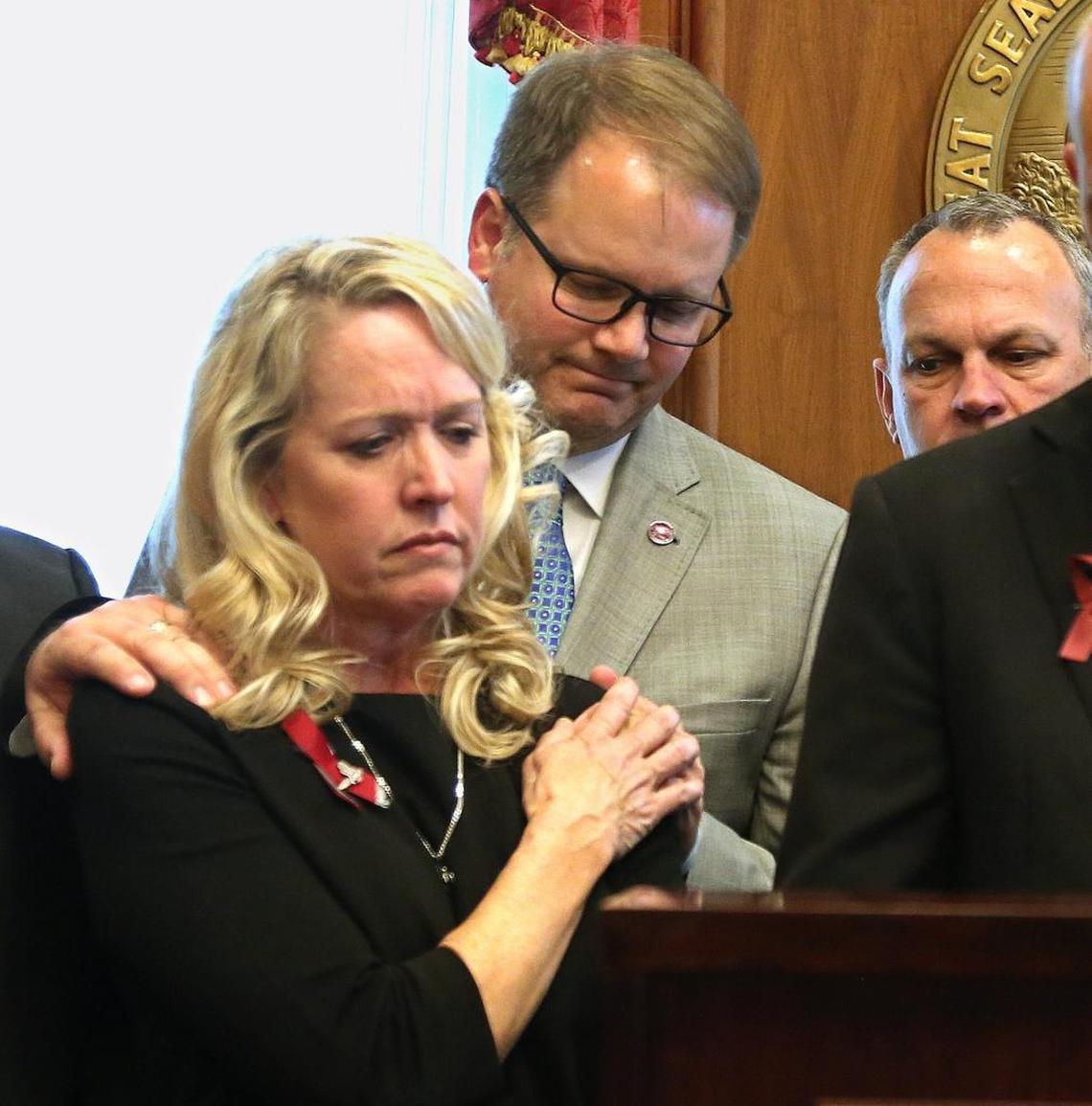 Marjory Stoneman Douglas parent Jennifer Montalto is consoled by another MSD parent, Ryan Petty, during the signing of the gun control and school safety bill at the Florida Capitol by Gov. Rick Scott, Friday, March 9, 2018. Both lost daughters in the shooting.
