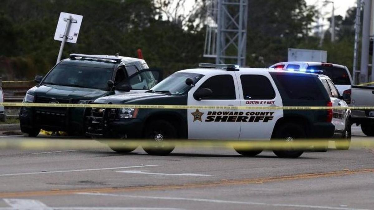 Broward Sheriff deputies secure the scene along North Dixie Highway in Pompano Beach where one of their own struck and killed a bicyclist Tuesday afternoon.