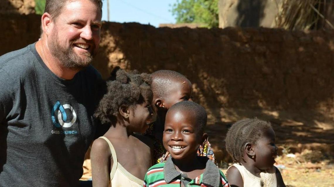 Michael Riddering was killed when al-Qaida militants attacked a hotel and cafe in Burkina Faso's capital of Ouagadougou Jan. 14. He is pictured with children in the orphanage in Burkina Faso.