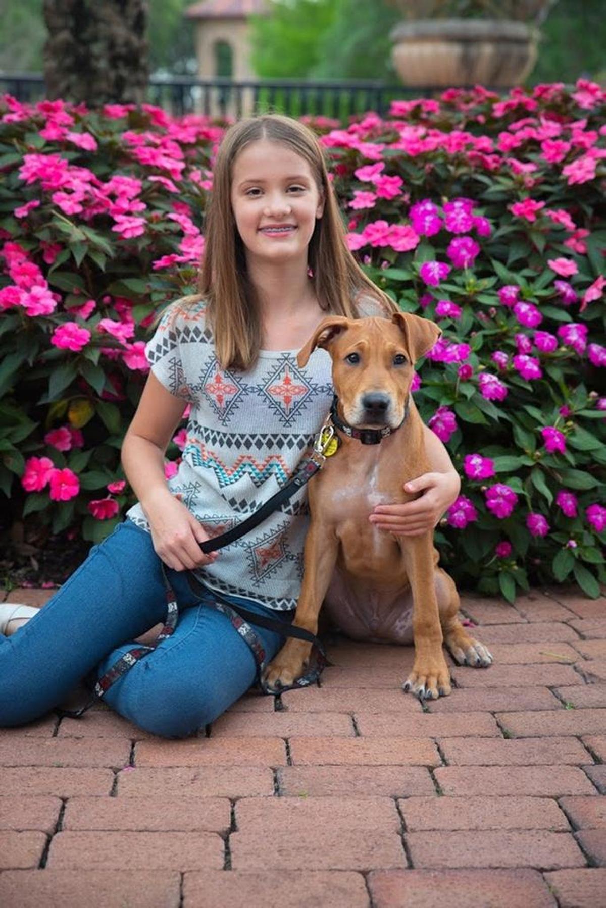 Alaina Petty, 14, poses with her puppy. She was one of the 17 people shot and killed on Valentine’s Day, 2018, in the mass shooting at Marjory Stoneman Douglas High School in Parkland.