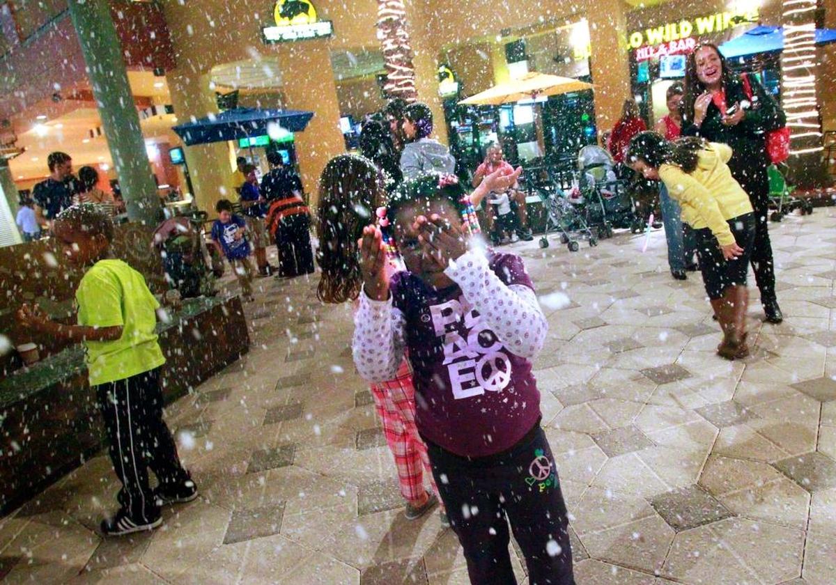 Janelle Rouse, 4, of Palmetto Bay, experiences her first “snowfall” at the Dolphin Mall’s “Magical Snowfall” in 2013. The flurries swirled on Janelle’s brother, Isiah Rouse, 5, left, and other visitors to the mall’s Ramblas Outdoor Plaza at Entrance 3. The event runs daily at 7 p.m. through Jan. 7, except for Christmas Eve and Christmas Day and New Year’s Eve and New Year’s Day.