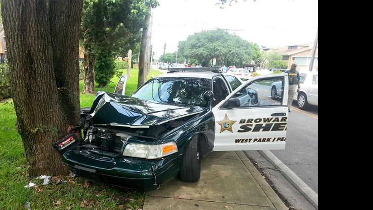 
Two deputies were injured Monday after their Broward Sheriff’s Office patrol car hit a tree as they prepared to pull over the driver of a stolen car. 
