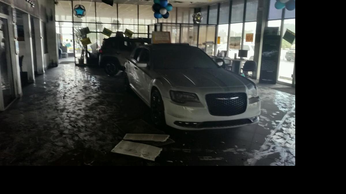 
Hollywood Chrysler Jeep's showroom, at 2100 North State Rd. 7, was damaged by a fire that began in an office Sunday morning 
