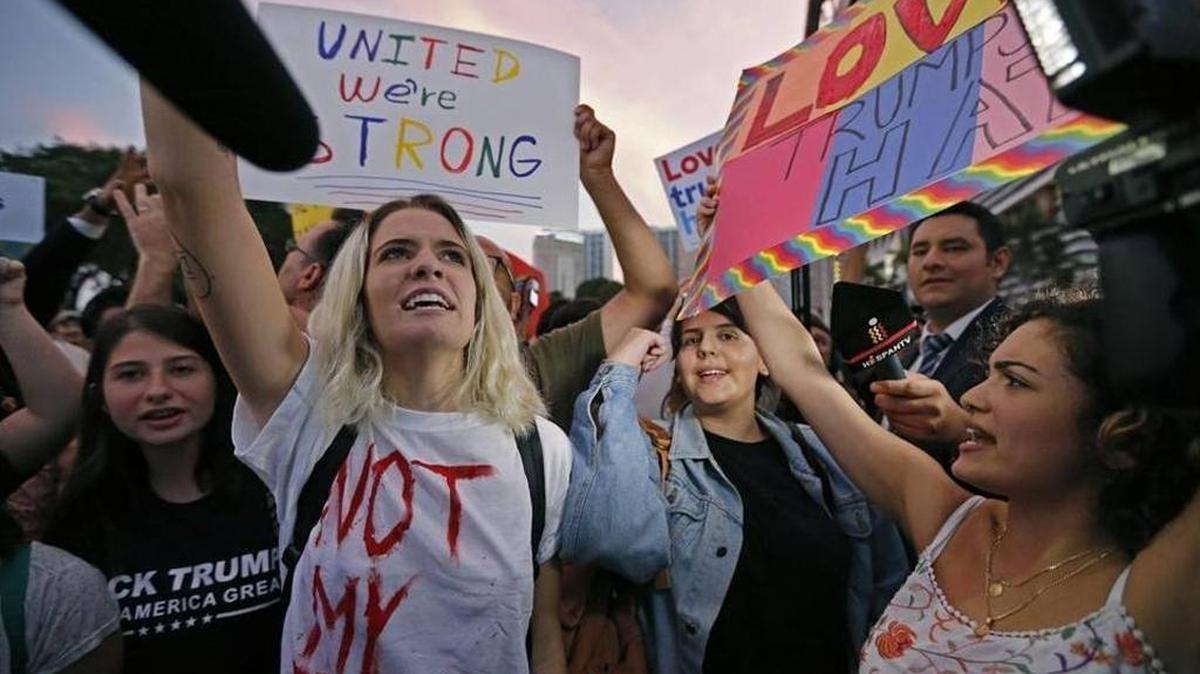 Demonstrators gather at Bayfront Park in Miami to protest President Elect Donald Trump on Friday, Nov. 11, 2016.