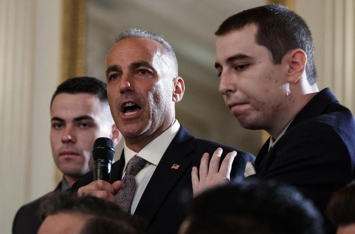 Andrew Pollack, father of slain Marjory Stoneman Douglas High School student Meadow Jade Pollack, joined by his sons, speaks during a listening session with President Donald Trump, high school students, teachers and others in the State Dining Room of the White House on Feb. 21, 2018.