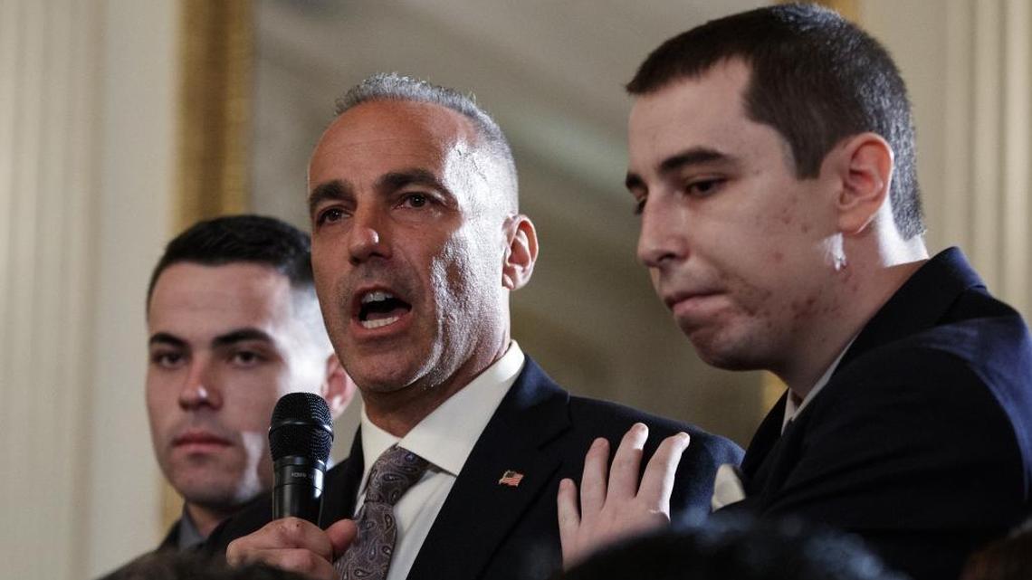 Andrew Pollack, father of slain Marjory Stoneman Douglas High School student Meadow Jade Pollack, joined by his sons, speaks during a listening session with President Donald Trump, high school students, teachers and others in the State Dining Room of the White House on Feb. 21, 2018.
