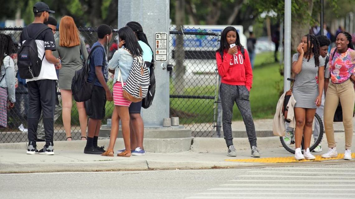 Students leave Coral Springs High School on Monday, Oct. 10, 2016. Coral Springs Police Sgt. Carla Kmiotek said two students reportedly saw a former student with a gun in his waistband in the parking lot of the school just before 1 p.m. The school was put on lockdown and the suspect was later found by police in the school's cafeteria and detained along with two current students.