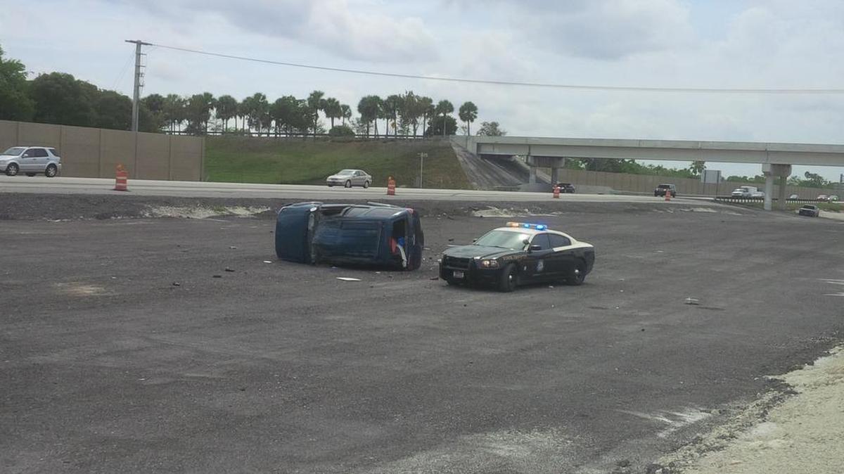 A minivan rolled over Saturday afternoon on I-75, sending the driver to the hospital and shutting the southbound lanes down entirely.