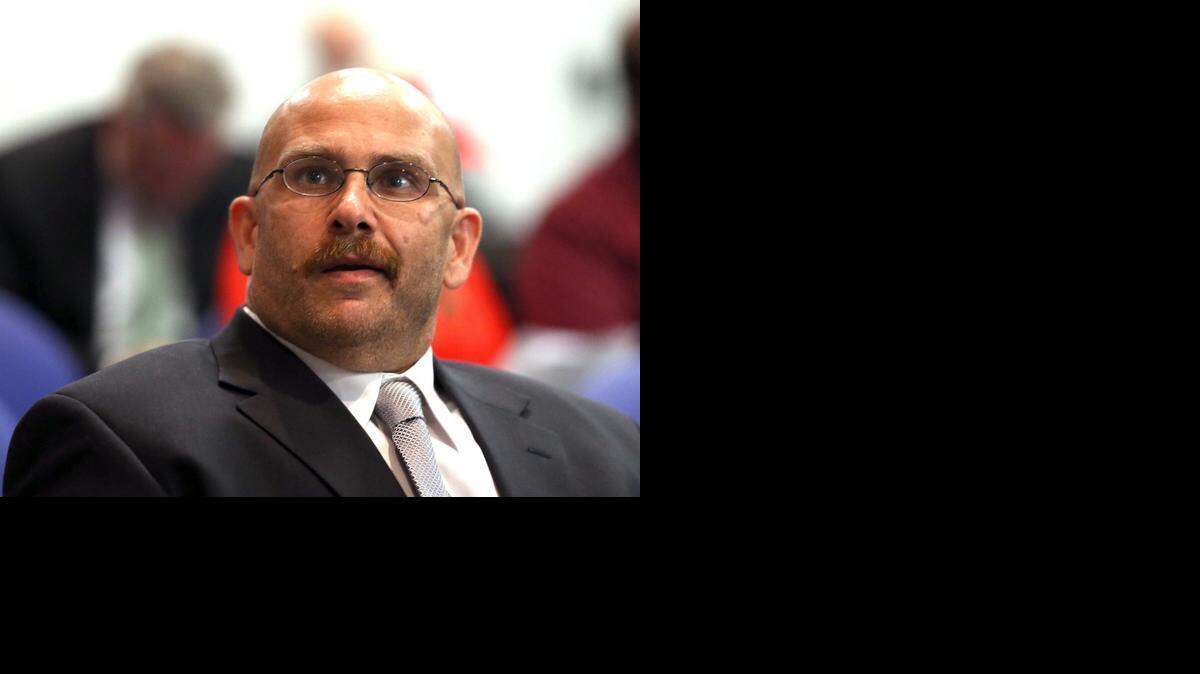 
Youssef Hassan Wardani listens in anger as the Broward County School Board on Tuesday, March 17, 2015, discusses the suspension of a Cypress Bay High French teacher for five days, for repeatedly calling his son a “raghead Taliban’’ when she addressed him in class. The student is of Lebanese and Moroccan descent, and is Muslim. The School Board suspended the French teacher, Maria Valdes, for five days without pay and required her to attend a diversity training program.
