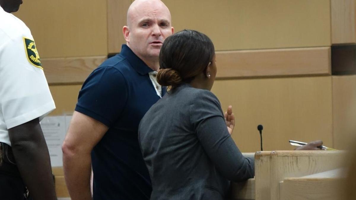 Christopher Wheeler, who is awaiting trial for child abuse, was taken into custody in a Broward Court on Tuesday for not providing a working iPhone pass code to police.