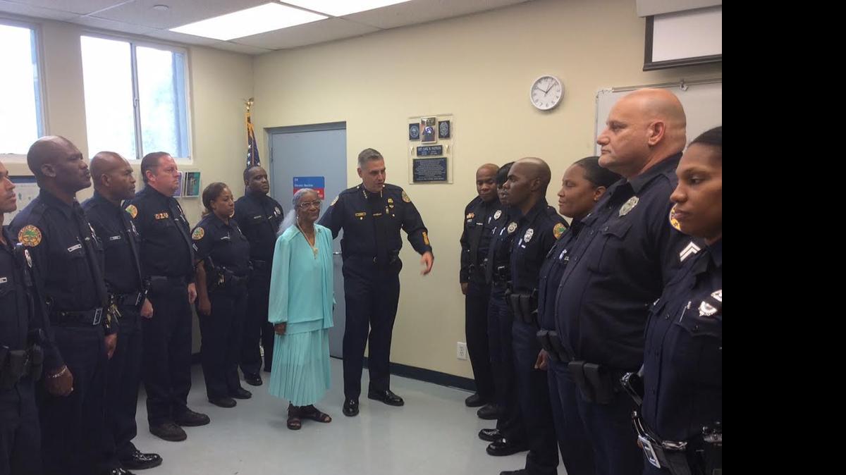 
Lucille Patrick honors her son Wednesday, along with other Miami police officers.
