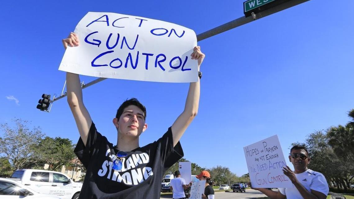 Josh Levine, 17, a student from Marjory Stoneman Douglas High School, stands at the corner of Westview Drive and University Drive, protesting for tighter gun control two days after Wednesday’s killing of 17 students and staff at the school.