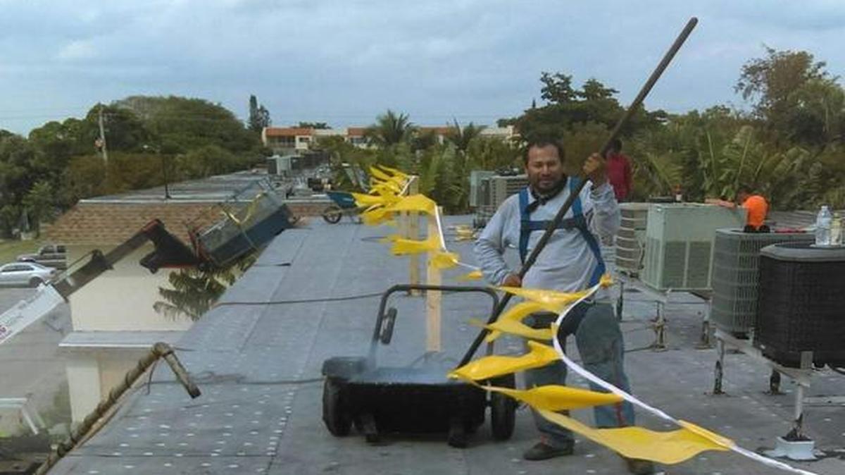 Tim Payton said this photo shows one of his workers wearing a safety harness.