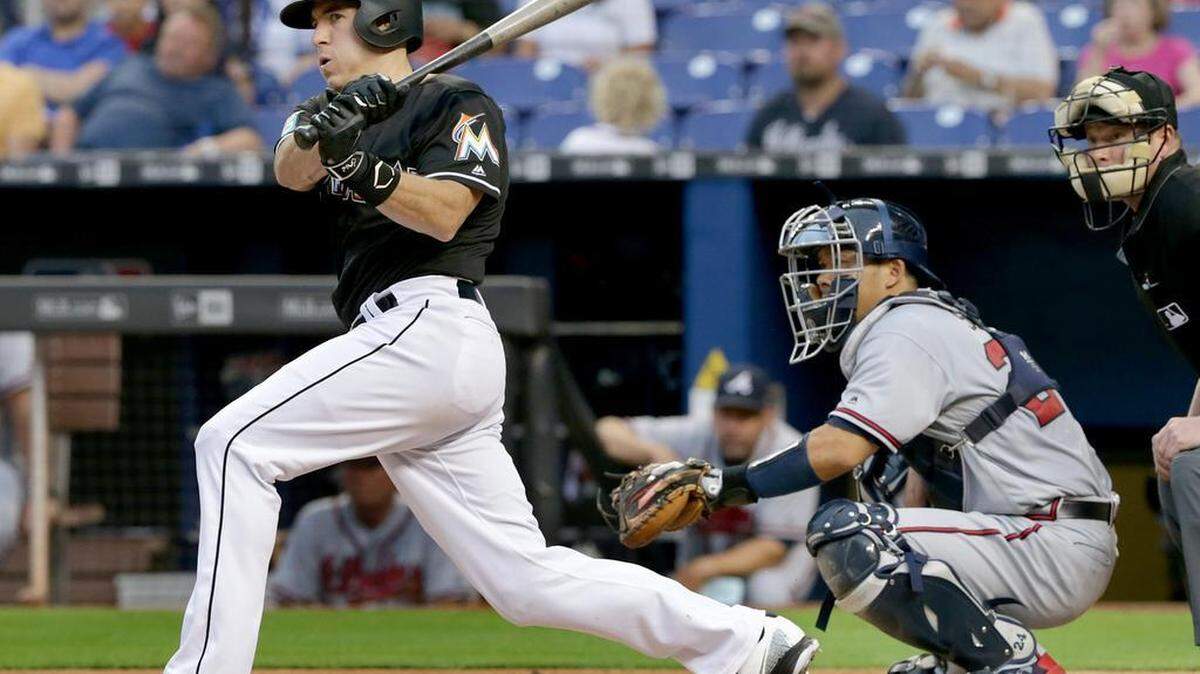 Marlins catcher J.T. Realmuto hits a double in the first inning of the Miami Marlins vs Atlanta Braves game at Marlins Park, Friday, May 11, 2018.