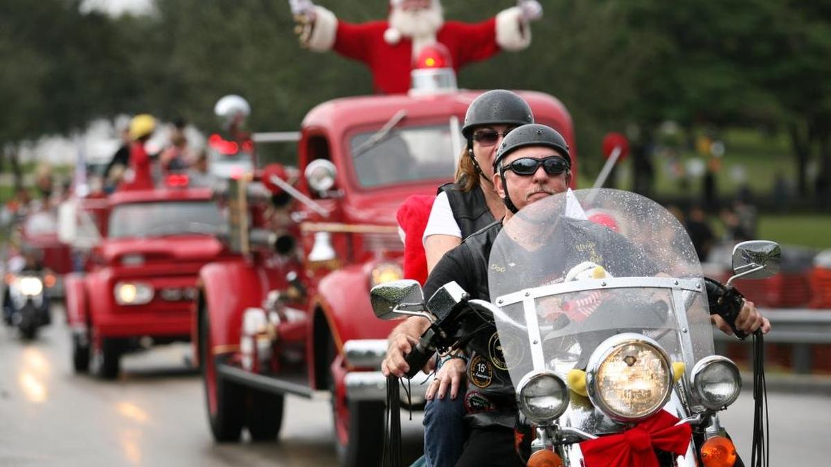 Santa Claus gets a motorcycle escort during the Toys in the Sun Run in 2011. The annual parade will make its way across Broward County and cause road closures on Sunday.