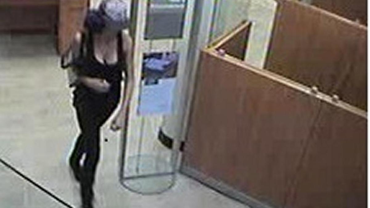 A woman the FBI believes to be Chelsea Wilson enters a Chase Bank to rob it on Oct. 3.