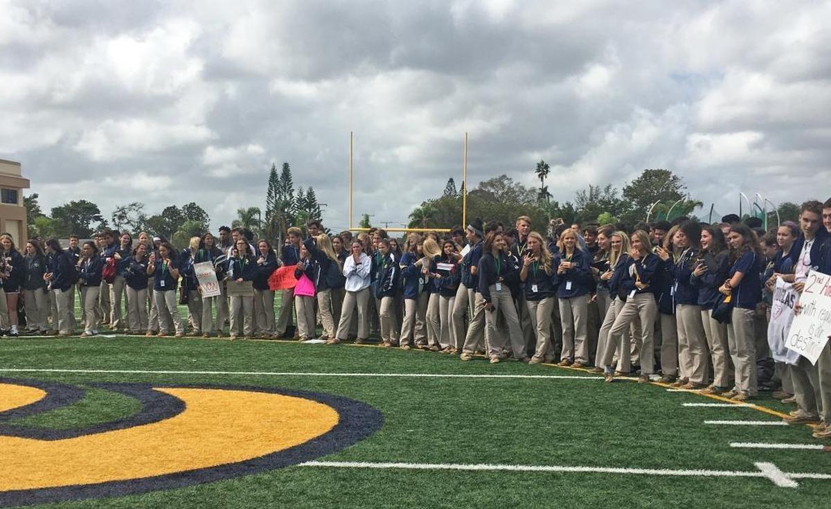 Students at St. Thomas Aquinas High School in Fort Lauderdale demonstrated with a walkout to the athletic field.