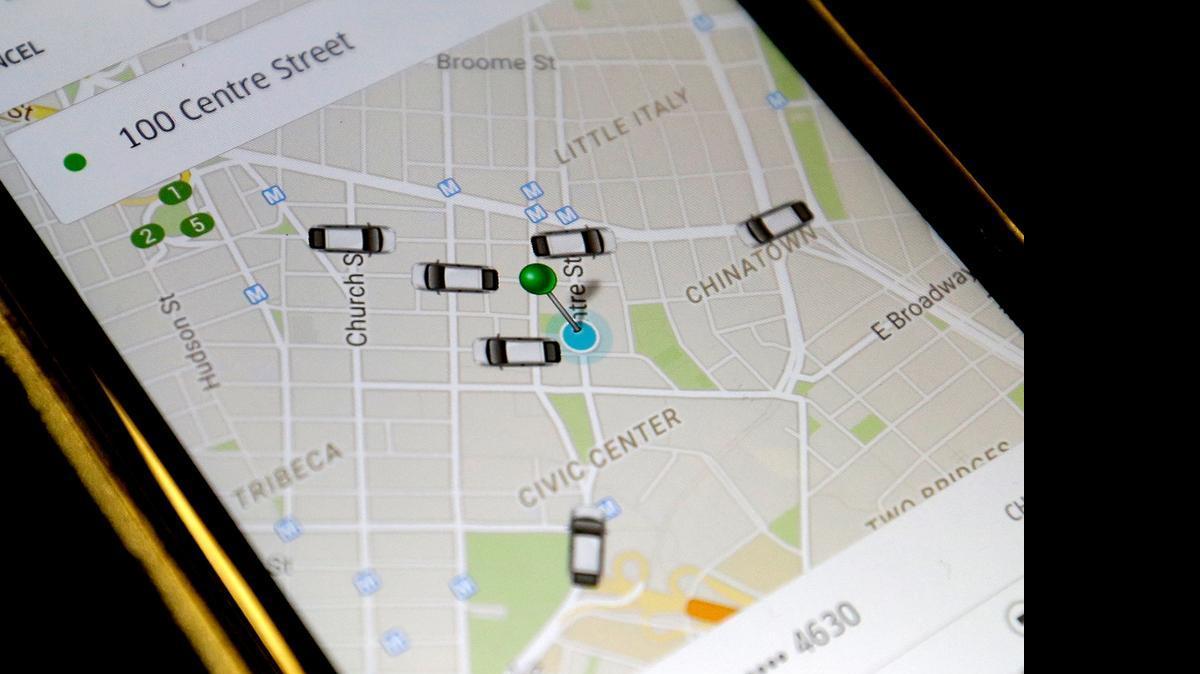 
FILE - In this Wednesday, March 18, 2015, file photo, the Uber app displays cars available to make pickups.
