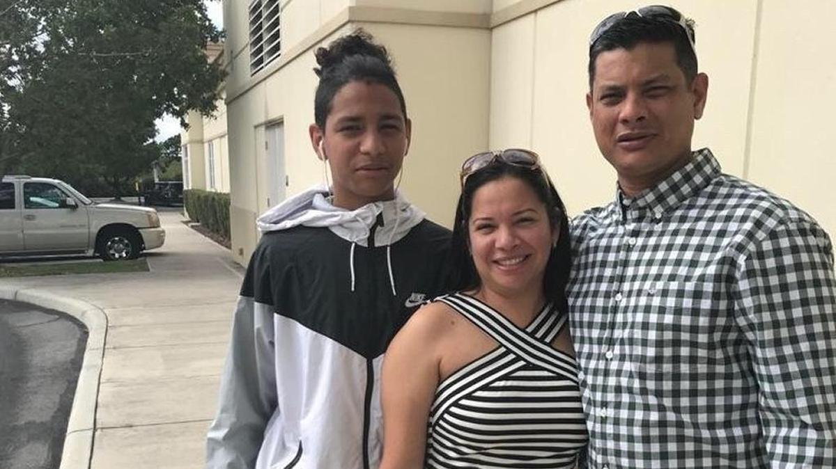 Anthony Borges, left, who was shot five times during the Marjory Stoneman Douglas mass shooting, with his parents. He underwent emergency surgery and is on a ventilator.