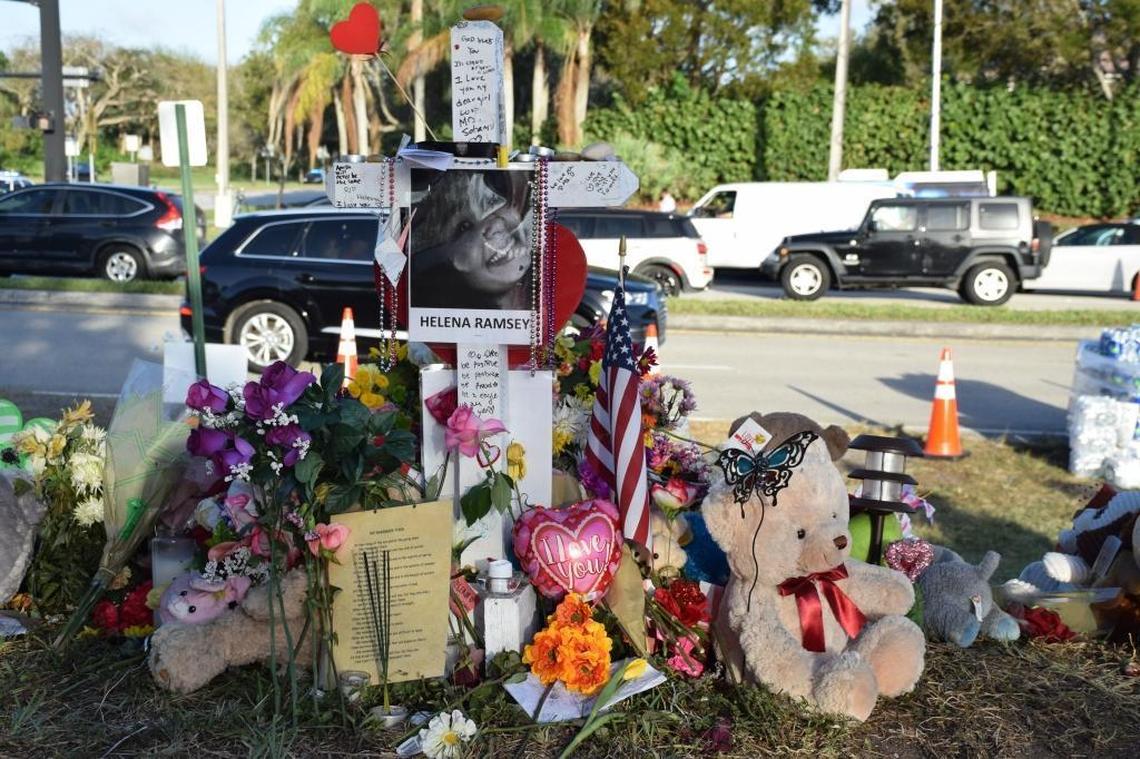 A memorial for Helena Ramsay and the other 16 victims of the Marjory Stoneman Douglas High School is seen at the school. Mourners have left numerous flowers and mementos.