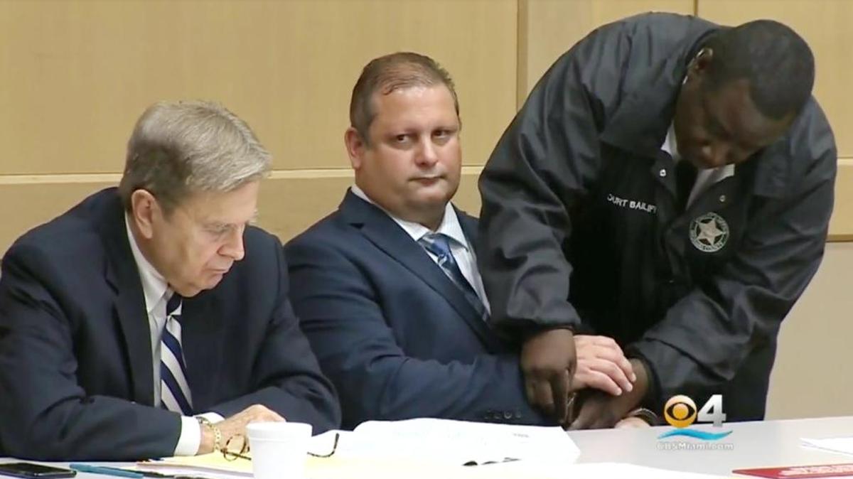 Augustine Bollo, 49, a Weston foot surgeon, is handcuffed on Friday after being found guilty of sexually abusing a teenage babysitter.