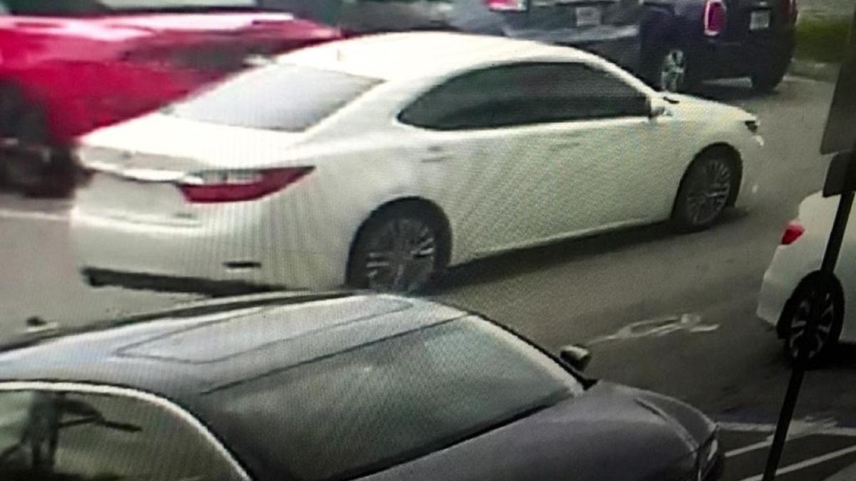 The FBI released a photo Tuesday of a white Lexus that investigators say was used as a getaway car by two men who robbed an armored car guard outside a furniture store at Sawgrass Mills mall.