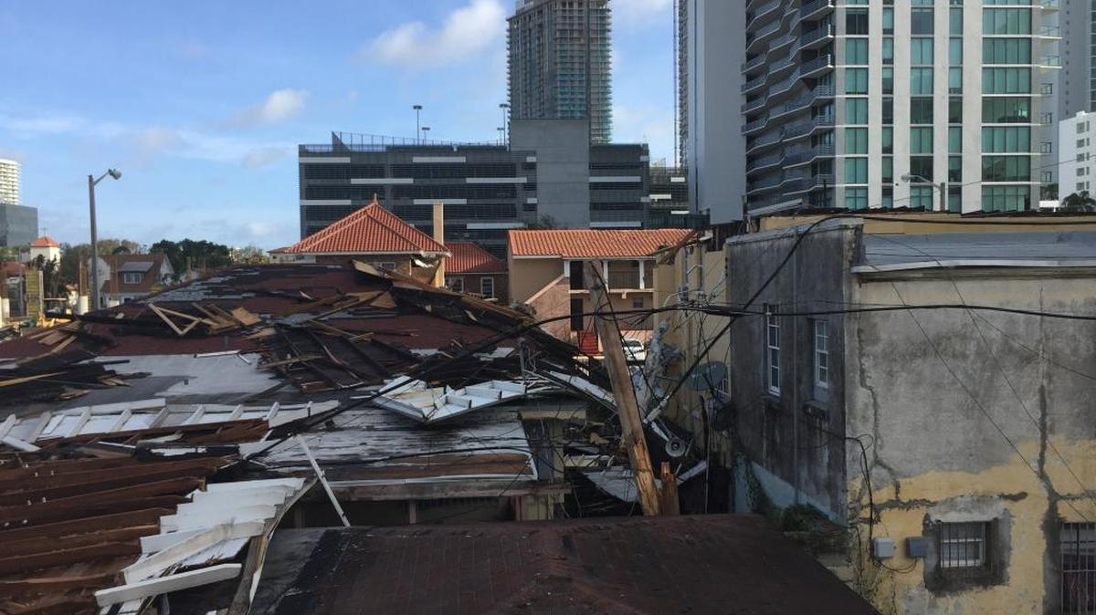 Hurricane Irma peeled the roof off of Gerard Duhart’s Edgewater home (right) and slammed it down onto a neighbor’s house.