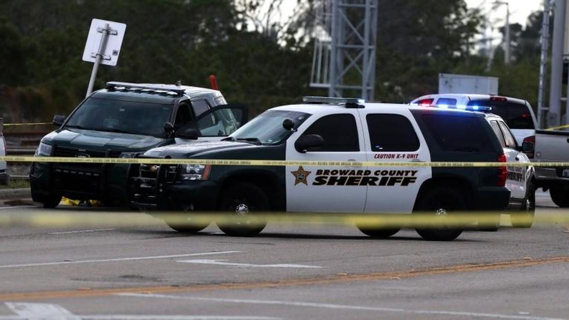 Broward Sheriff deputies secure the scene along Dixie Highway in Pompano Beach where one of their own struck and killed a bicyclist Tuesday afternoon.