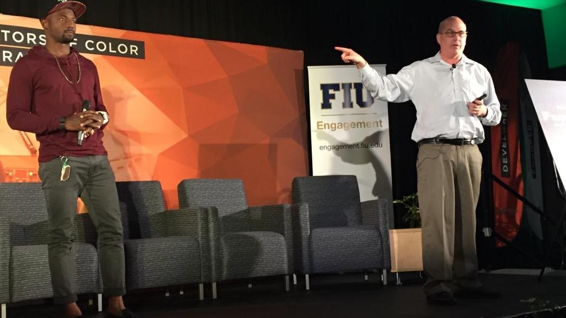 Santonio Holmes, a pro football player, and Jeff Hoffman, co-founder of Priceline, share the stage at Blacktech Week at Florida International University.